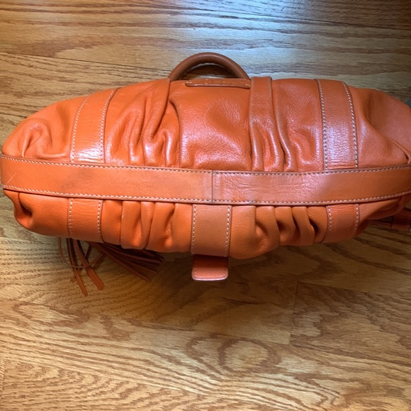 Cole Hahn orange handbag with fringe and silver hardware. - Picture 16 of 16